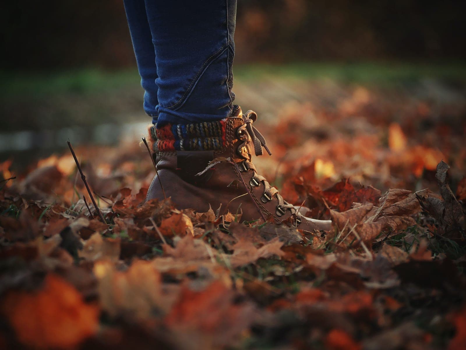 Leather boots being wiped down with a cloth