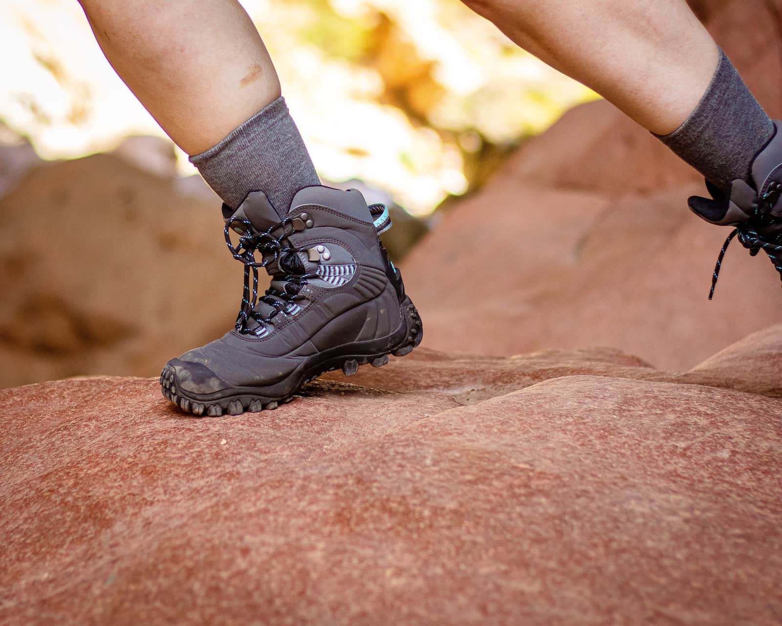 Hiking boots standing outdoors on a rocky trail