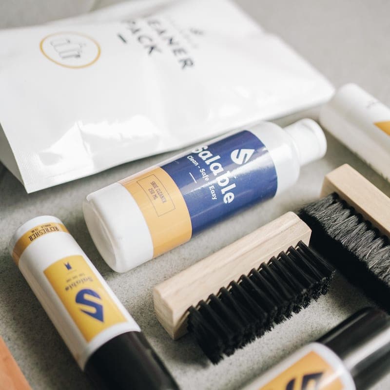 A footwear cleaning kit with brushes and tins - a stand-in for the Bickmore Bick 1 Leather Cleaner, not a photograph of this model