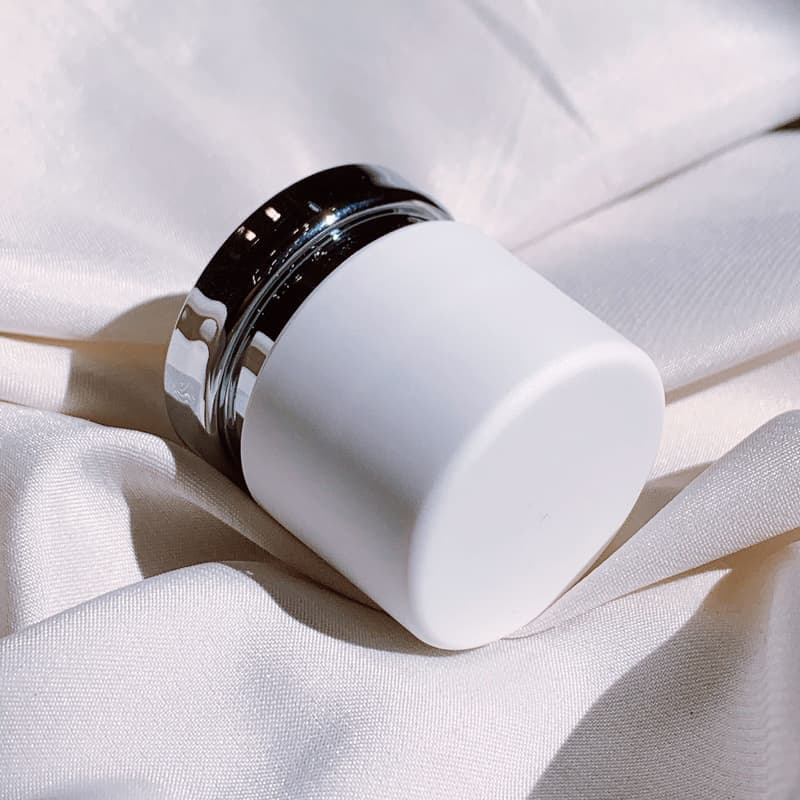 A jar of leather conditioning cream with an application cloth - a stand-in for the Lexol Leather Conditioner, not a photograph of this model